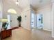 Bright and airy foyer with tile floors and access to other rooms at 154 Robin Rd, Davenport, FL 33896