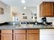 Kitchen boasts a double sink, dishwasher, and breakfast bar at 154 Robin Rd, Davenport, FL 33896