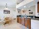 Bright kitchen with breakfast nook and view into adjacent living area at 154 Robin Rd, Davenport, FL 33896