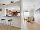 Well-equipped kitchen with wooden cabinetry and breakfast bar at 154 Robin Rd, Davenport, FL 33896