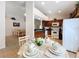 Modern kitchen with white appliances and a breakfast nook at 154 Robin Rd, Davenport, FL 33896