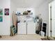Laundry room with washer, dryer, and shelving at 154 Robin Rd, Davenport, FL 33896