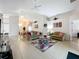 Open-concept living space with tile floors and ample natural light at 154 Robin Rd, Davenport, FL 33896