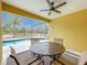 Screened patio with pool and lake view at 154 Robin Rd, Davenport, FL 33896