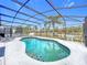 Inviting pool and screened patio with lake view at 154 Robin Rd, Davenport, FL 33896