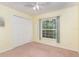 Bedroom with double door closet and ceiling fan at 1608 Nectarine Trl, Clermont, FL 34714