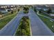 Aerial view of a residential community with landscaped streets and homes at 1657 Rosydale Cir, Davenport, FL 33837