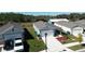 Row of three-bedroom houses with attached garages and spacious yards at 1657 Rosydale Cir, Davenport, FL 33837