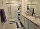 Bathroom with double sinks, shower, and modern vanity at 1657 Rosydale Cir, Davenport, FL 33837