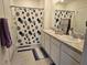 Bathroom with double sinks, shower, and modern vanity at 1657 Rosydale Cir, Davenport, FL 33837