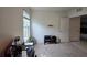 Bedroom with home office setup and window at 1657 Rosydale Cir, Davenport, FL 33837