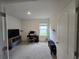 Bedroom with home office setup and window at 1657 Rosydale Cir, Davenport, FL 33837