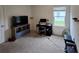 Bedroom with home office setup and window at 1657 Rosydale Cir, Davenport, FL 33837