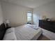 Bright bedroom with a double bed, dresser, and window at 1657 Rosydale Cir, Davenport, FL 33837