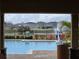 View of community pool from covered patio at 1657 Rosydale Cir, Davenport, FL 33837