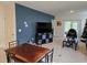 Dining area with a rustic wood table and chairs at 1657 Rosydale Cir, Davenport, FL 33837