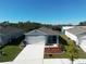 Newly constructed home with a two-car garage and landscaped front yard at 1657 Rosydale Cir, Davenport, FL 33837