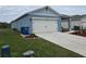 Two-car garage and nicely landscaped front yard at 1657 Rosydale Cir, Davenport, FL 33837
