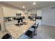 Open kitchen with island, stainless steel appliances, and white cabinets at 1657 Rosydale Cir, Davenport, FL 33837
