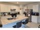 Open concept kitchen with island and stainless steel appliances at 1657 Rosydale Cir, Davenport, FL 33837