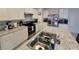 Modern kitchen with stainless steel appliances and an island at 1657 Rosydale Cir, Davenport, FL 33837