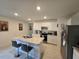 Spacious kitchen with island, white cabinets and stainless steel appliances at 1657 Rosydale Cir, Davenport, FL 33837