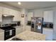 Eat-in kitchen with stainless steel appliances and an island at 1657 Rosydale Cir, Davenport, FL 33837