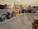 Walk-in pantry with ample shelving for storage at 1657 Rosydale Cir, Davenport, FL 33837