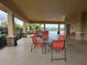 Relaxing covered patio with table and chairs near pool at 1657 Rosydale Cir, Davenport, FL 33837