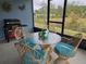 Screened patio with table, chairs, and grill at 1657 Rosydale Cir, Davenport, FL 33837