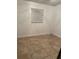 Simple bedroom with tile floors and neutral walls at 1808 S Mulberry Ave, Sanford, FL 32771