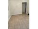 Simple bedroom with tile floors and neutral walls at 1808 S Mulberry Ave, Sanford, FL 32771