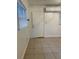 Bright entryway with tile floors and white door at 1808 S Mulberry Ave, Sanford, FL 32771