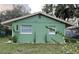 Newly painted green house with well-manicured lawn at 1808 S Mulberry Ave, Sanford, FL 32771