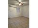 Spacious living room featuring tile floors and a ceiling fan at 1808 S Mulberry Ave, Sanford, FL 32771