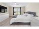 Spacious main bedroom with a king-size bed and plenty of natural light at 1982 Birnham Wood Bnd, Kissimmee, FL 34746