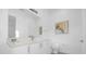 Stylish bathroom with a toilet and white vanity with a large mirror at 2137 Pine Oak Loop, Davenport, FL 33837