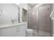 Clean bathroom with a walk-in shower and white vanity at 2137 Pine Oak Loop, Davenport, FL 33837