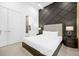 Elegant bedroom with king-size bed and dark accents at 2137 Pine Oak Loop, Davenport, FL 33837