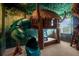 Playful bedroom with treehouse bed and slide at 2137 Pine Oak Loop, Davenport, FL 33837