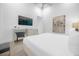 Modern bedroom with a comfortable bed and built-in desk at 2137 Pine Oak Loop, Davenport, FL 33837
