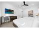 Well-lit bedroom with two beds, a large TV, and a desk at 2137 Pine Oak Loop, Davenport, FL 33837
