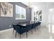 Spacious dining room with large table and navy blue chairs at 2137 Pine Oak Loop, Davenport, FL 33837
