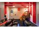 Fun game room with Pac-Personal theme and arcade games at 2137 Pine Oak Loop, Davenport, FL 33837
