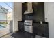 Built-in stainless steel grill with overhead vent at 2137 Pine Oak Loop, Davenport, FL 33837