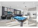 Open concept kitchen with island, stainless steel appliances, and pool table at 2137 Pine Oak Loop, Davenport, FL 33837