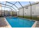 Screened-in pool and spa with lounge chairs at 2137 Pine Oak Loop, Davenport, FL 33837