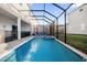 Screened-in pool and spa with lounge chairs at 2137 Pine Oak Loop, Davenport, FL 33837