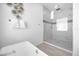 Large walk-in shower with marble tile at 2137 Pine Oak Loop, Davenport, FL 33837
