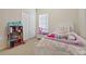 bedroom with twin bed, toys, and closet at 2220 Betsy Ross Ln # C, St Cloud, FL 34769